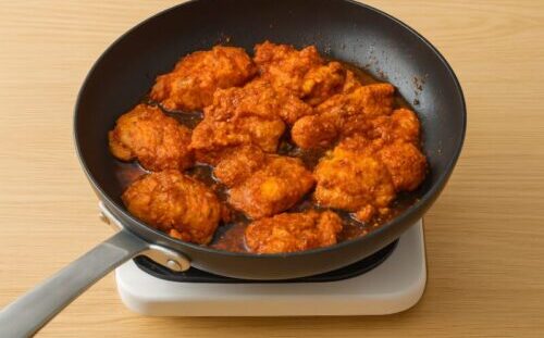 Chicken pieces pan-fried until golden brown for juicy chicken tacos with homemade seasoning