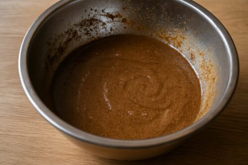 Sweet and spicy glaze being mixed in bowl for honey glazed ham