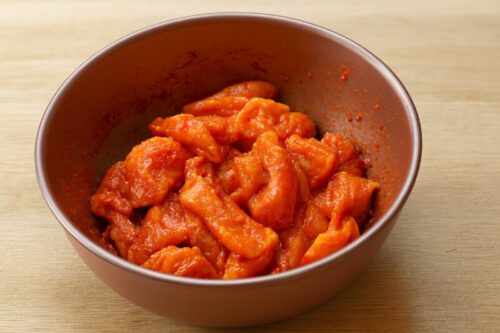 Indian-Butter-Chicken-1 Boneless chicken pieces mixed with ginger, garlic, red chili powder, and salt for marination