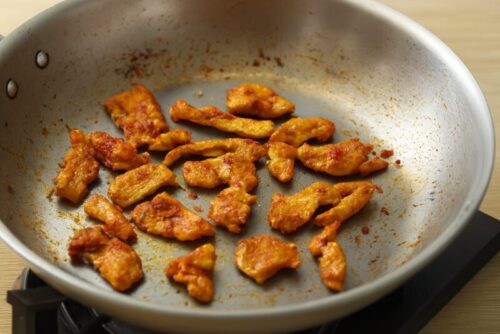 Indian-Butter-Chicken-2 Marinated chicken being pan-fried on medium heat until golden and cooked through