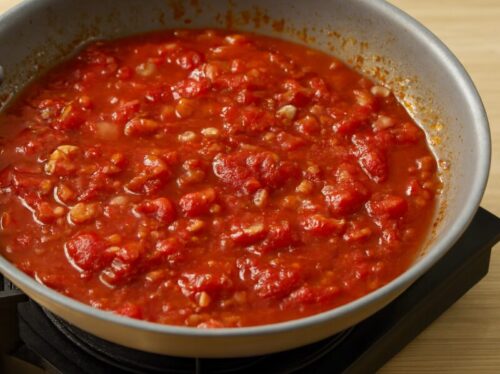 Indian-Butter-Chicken-3 Onions, tomatoes, cashews, and spices simmering in butter and oil for butter chicken gravy
