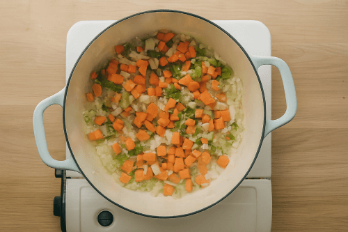 Step 2 - Add the garlic, onion, carrot, celery and cook them