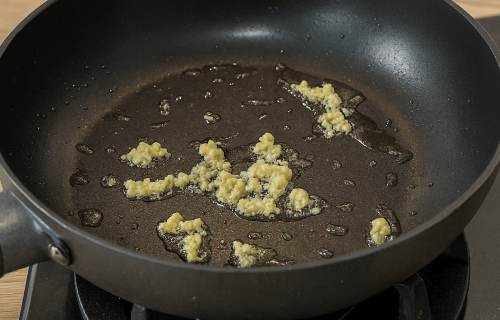 One-Pot Creamy Garlic Pasta - Cook garlic in oil