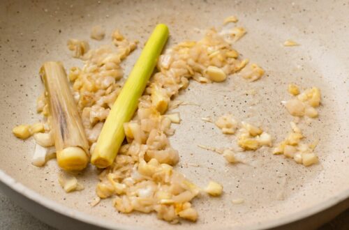 Sautéing lemongrass, shallots, and garlic until lightly golden to release aroma for cooking base