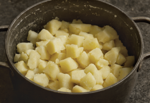 Draining boiled potatoes in a colander