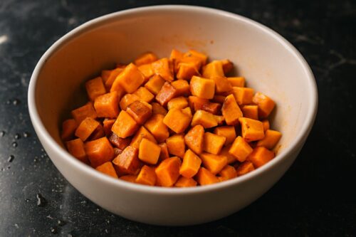 Chopped sweet potatoes arranged for Sweet Potato Breakfast Hash prep