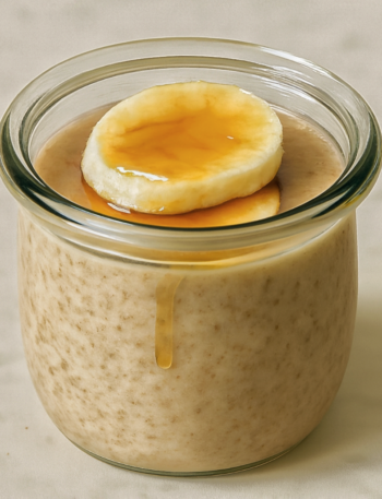 Overnight oats topped with banana slices and honey drizzle ready to serve